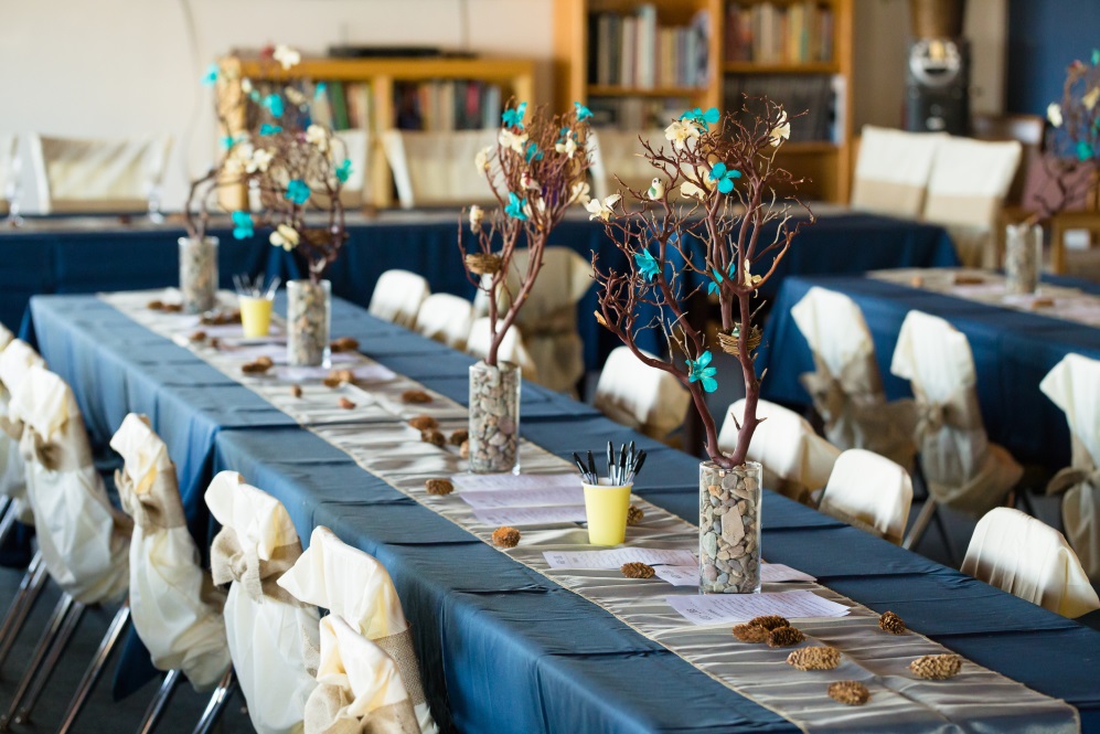 Long dinner table with navy tablecloth