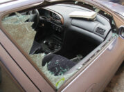 image of a car window smashed in an attempted theft of the vehicle.