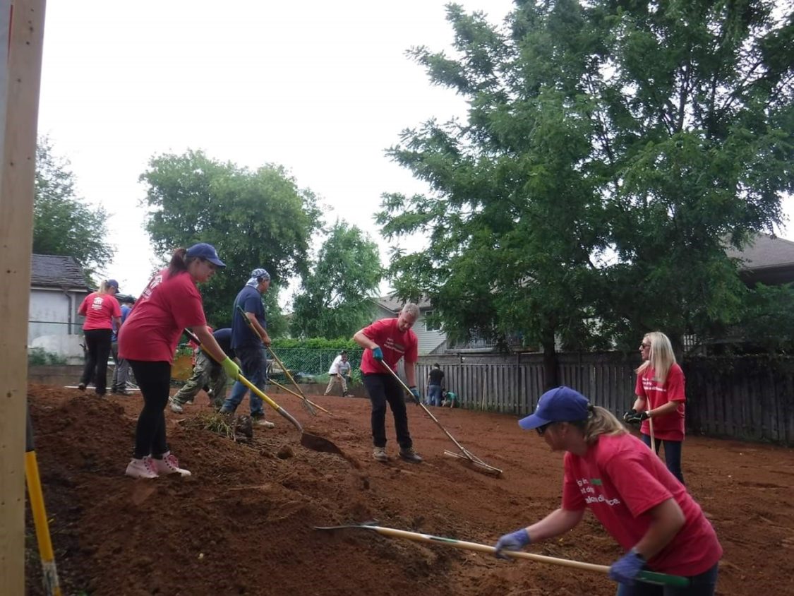 Image of Allstate Agents volunteering with Habitat for Humanity digging a foundation for a house