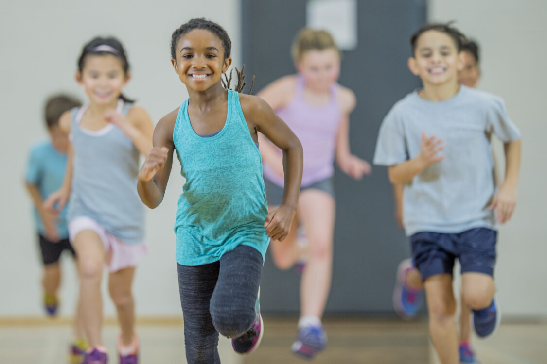 photo of diverse children exercising  