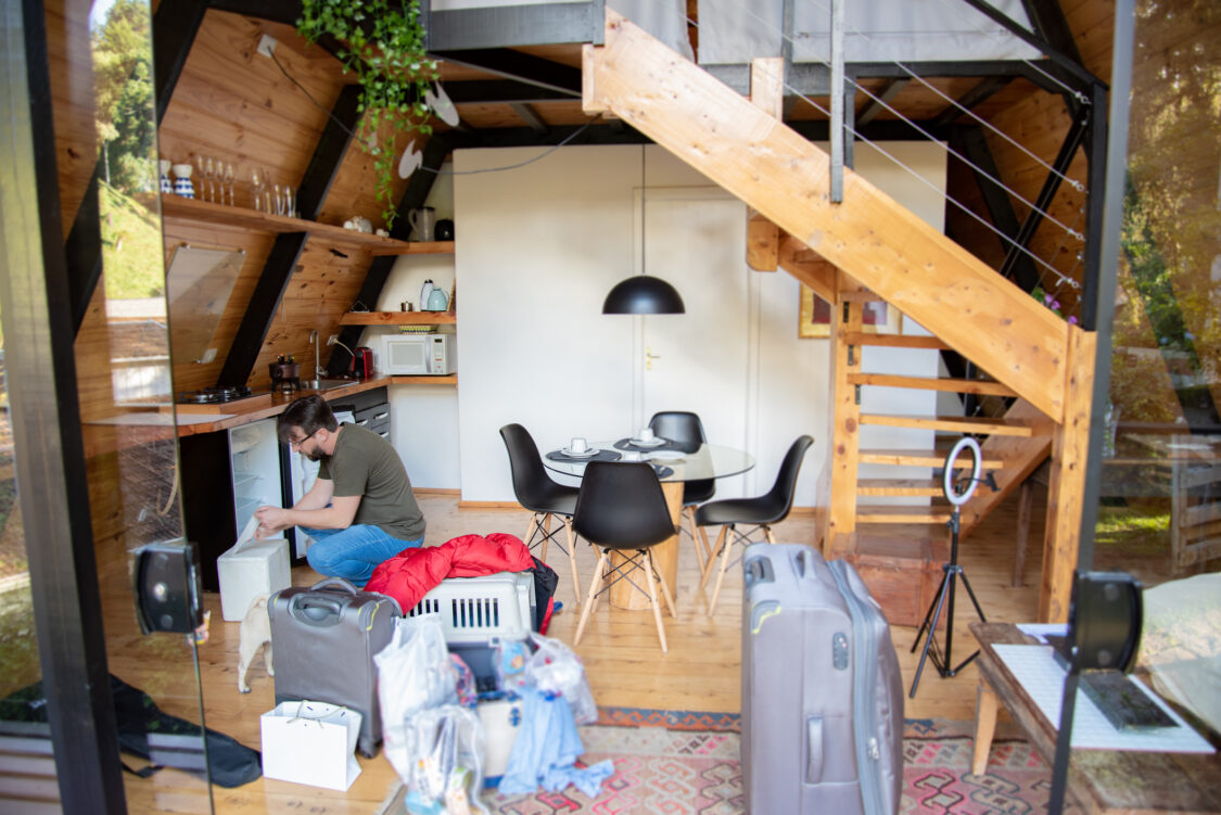 Person inspecting the inside of their cottage