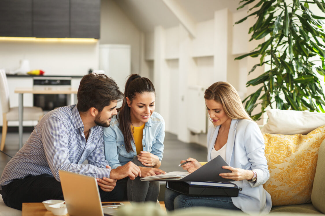 couple speaking with an insurance agent