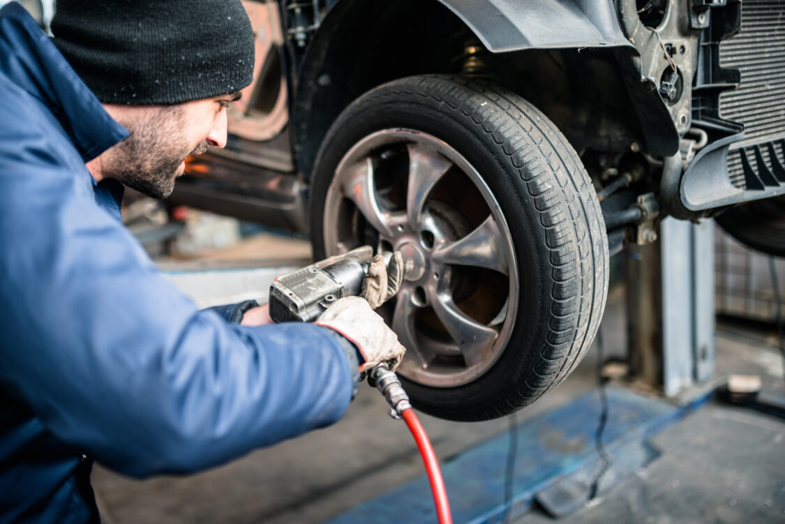 tire repairer changing the car tire
